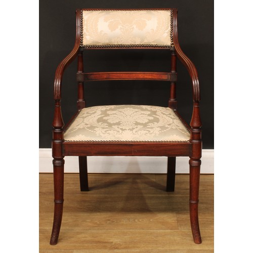 1759 - A Regency mahogany bar-back elbow chair, stuffed-over upholstery with studded borders, channelled ar... 