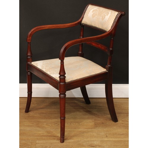 1759 - A Regency mahogany bar-back elbow chair, stuffed-over upholstery with studded borders, channelled ar... 