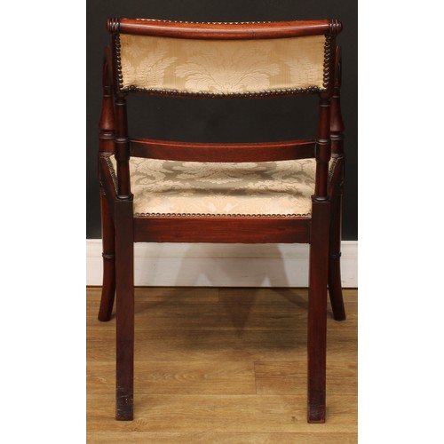 1759 - A Regency mahogany bar-back elbow chair, stuffed-over upholstery with studded borders, channelled ar... 