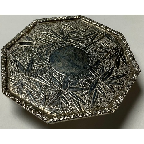 92 - A Chinese silver miniature three piece tea service on tray, chased with leafy bamboo,the octagonal t... 