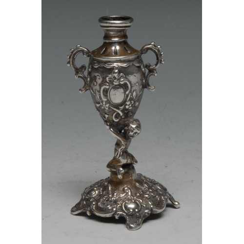 105 - A Continental silver specimen vase, as a putto holding an urn, import marks for London 1899, 78g