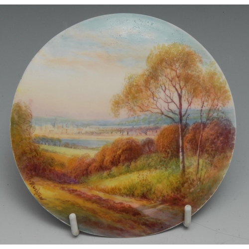 A Royal Worcester circular plaque, painted by R. Rushton, signed, with