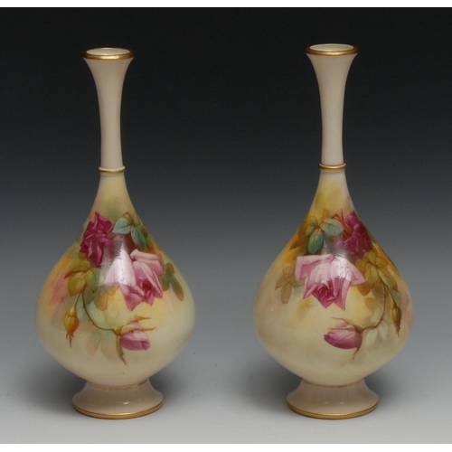 573 - A pair of Royal Worcester bottle vases, painted by Sedgley, with roses in Hadley style, 24.5cm high,... 