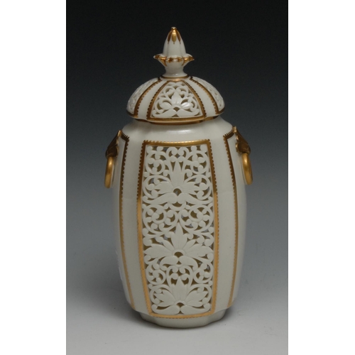 567 - A Graingers Worcester reticulated vase and cover, moulded ring handles, outlined in gilt, 23cm high,... 