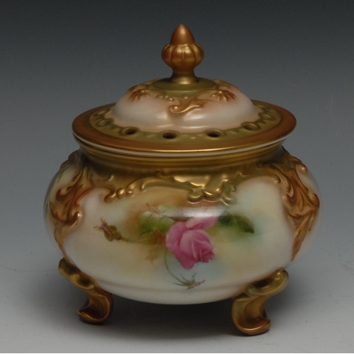 634 - A Royal Worcester pot pourri vase and cover, painted with roses, raised with acanthus scrolls, pierc... 