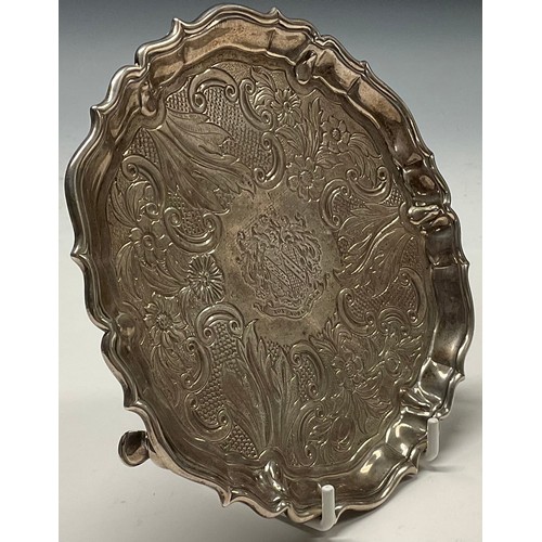 121 - A George II silver shaped circular waiter, fluted border, the field chased with a band of flowers, C... 