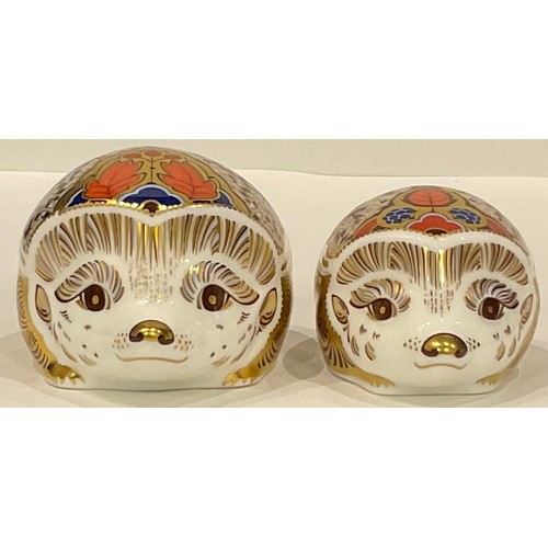 8 - A Royal Crown Derby paperweight, Hawthorn Mother Hedgehog, gold stopper; another, Bramble baby Hedge... 