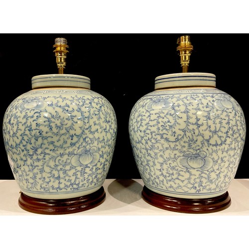 86 - A pair of Chinese ginger jars, later converted to table lamps, 31cm over fittings