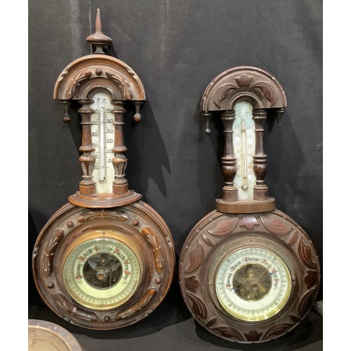 95 - A set of 19th century Chinese carved hardwood bellows; an early 20th century carved mahogany baromet... 