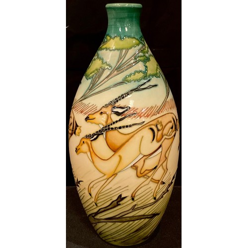 119 - A Moorcroft Gazelle pattern ovoid vase, tube lined with leaping animals against the backdrop of an A... 