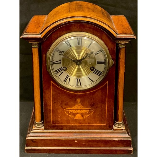 139 - An Edwardian mahogany inlaid mantel clock, silvered chapter ring with Roman numerals, twin winding h... 