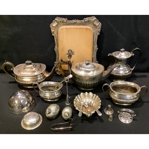 141 - Plated Ware - a Victorian E.P.N.S mounted bread board; a four piece tea service; another teapot; etc