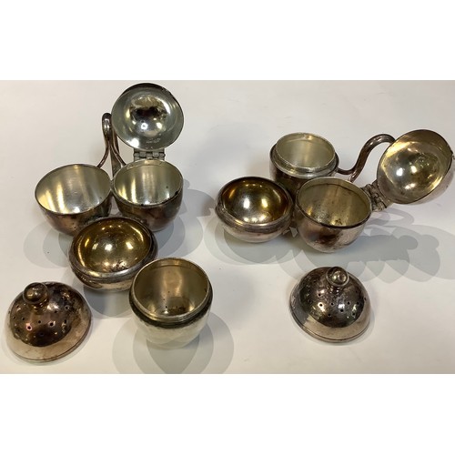 148 - Design, Post 1860 - a pair of Elkington & Co silver plated condiment cruets, in the manner of Dr Chr... 