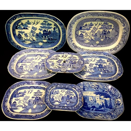 172 - A large Victorian willow pattern meat plate, 55.5cm wide; another, with associated strainer plate, 4... 