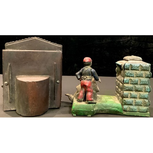 195 - A cast iron mechanical money bank, modelled as a Punch and Judy theatre, 18cm high; another, Artille... 