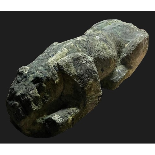 3163 - A 19th century stone garden statue,  of a dog crouching,  70cm long,  26cm high




**Please note th... 