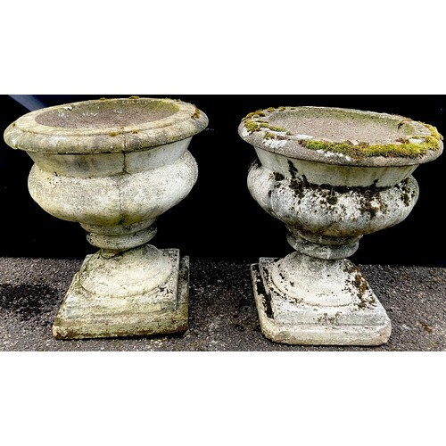 3152 - A pair of composite campana shaped garden vases, square bases



**Please note that some of the lots... 