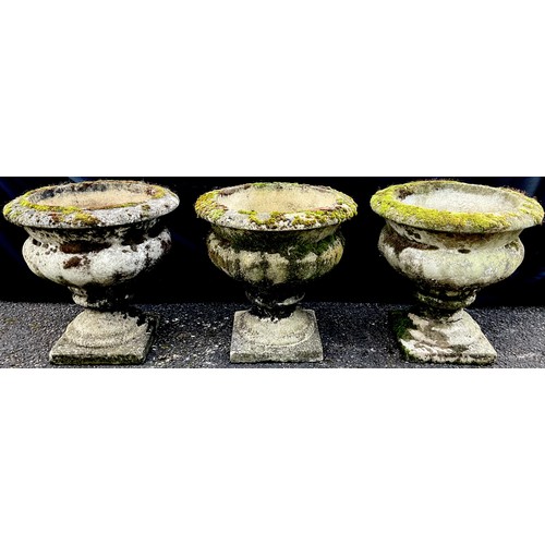 3156 - A set of tree composite campana shaped garden vases, square bases


**Please note that some of the l... 