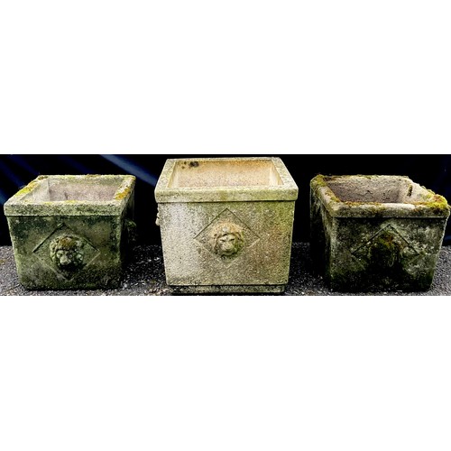 3157 - A pair of composite square planters, in relief with lion masks;  another, larger (3)


**Please note... 