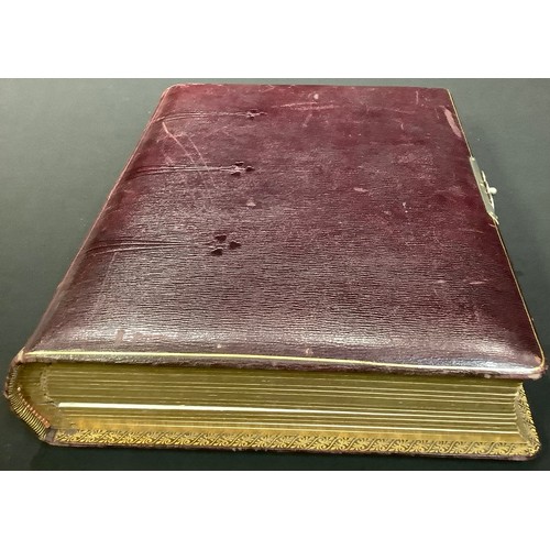 217 - Photography - an Edwardian leather bound carte de visite album, containing various single and groupe... 