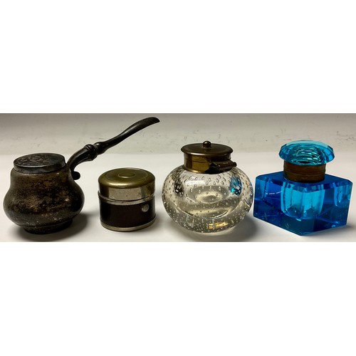 224 - An early 20th century travelling inkwell; a blue glass inkwell; a clear glass inkwell with buble inc... 