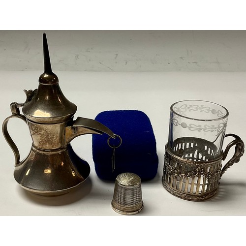 236 - A silver thimble, Birmingham 1991; a silver cased glass, marked 925; silver miniature Dallah coffee ... 