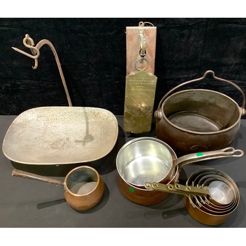 342 - Kitchenalia - a set of five graduated brass handled copper saucepans; other copper pans; a cast iron... 