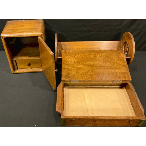 343 - An Arts and Crafts oak book rack; an Art Deco oak box; a smokers cabinet (3)