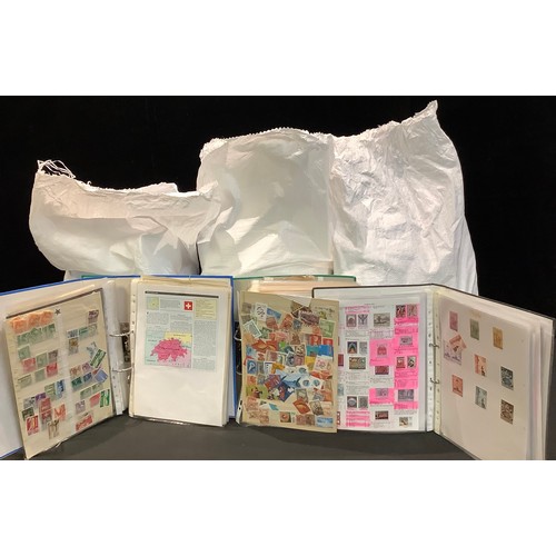 425 - Stamps - three large bags of material, albums, binders, vast quantity