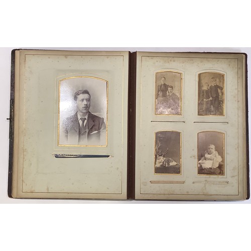 250 - Photography - an Edwardian leather bound carte de visite album, containing various single and groupe... 