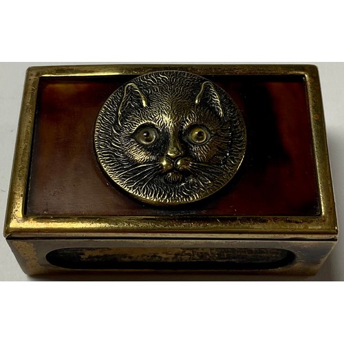 469 - A 19th century matchbox brass and tortoiseshell matchbox case, mounted with cat roundel set with gla... 