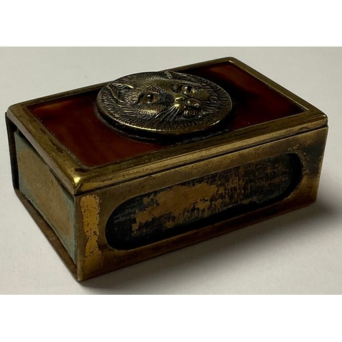 469 - A 19th century matchbox brass and tortoiseshell matchbox case, mounted with cat roundel set with gla... 