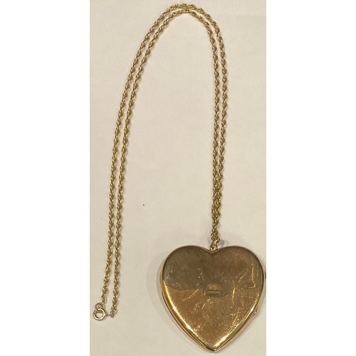 503 - A 9ct gold heart shaped locket and chain, 14.3g gross