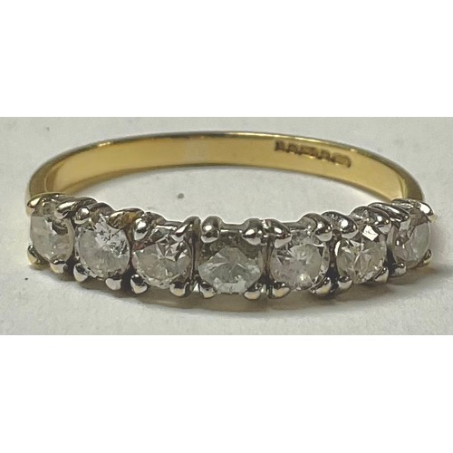 510 - An 18ct gold seven stone diamond ring, size L, marked 750, 2g