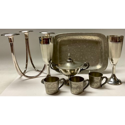 590 - A Norwegian Skurdal pewter tray with three cups; a 20th century three branch table candlestick, 19cm... 