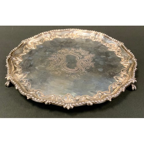 95 - A Victorian silver salver, engraved and chased to centre, the rim embossed with scrolls, beaded rim,... 