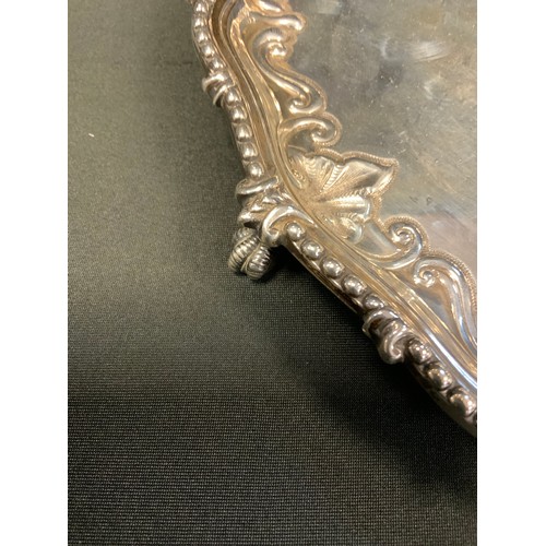 95 - A Victorian silver salver, engraved and chased to centre, the rim embossed with scrolls, beaded rim,... 