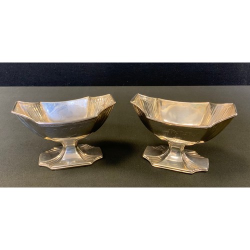 94 - A pair of George III silver pedestal boat shaped salts, fluted incurved  angles, 6.5cm high, 	John R... 