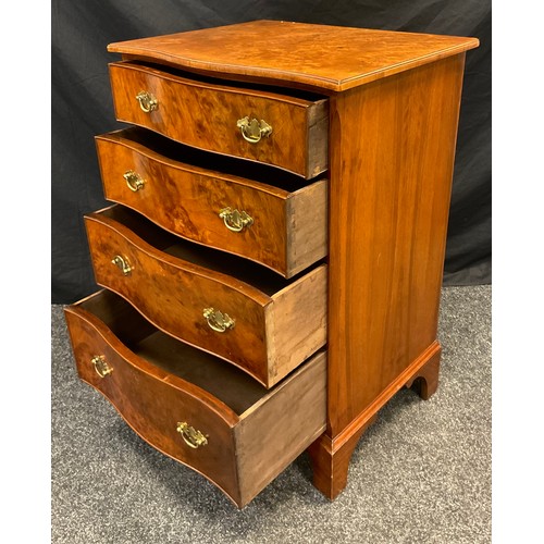 15 - A 20th century George III style, burr walnut, reproduction narrow chest of drawers, over-sailing top... 