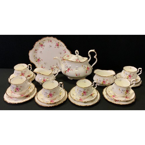 54 - A Royal Albert, Tenderness pattern tea service for six, comprising - large tea pot, six tea cups and... 