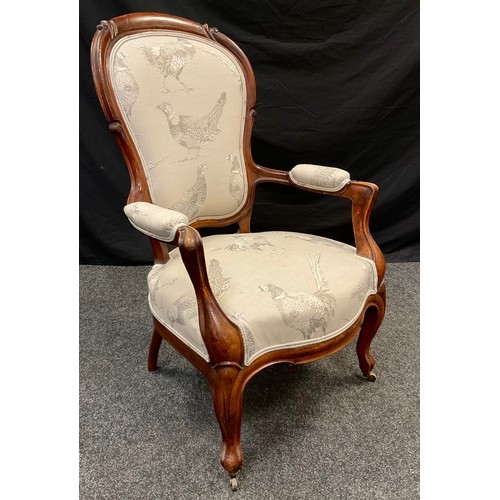 57 - A late Victorian walnut sitting room armchair, bow-back, upholstered back, arms, and seat, cabriole ... 