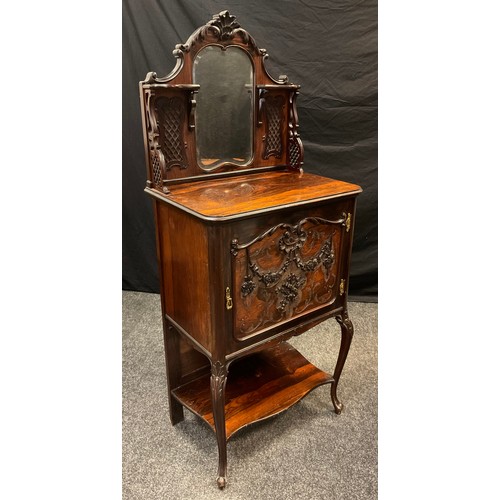 60 - An Edwardian Rosewood music cabinet, galleried back with carved cresting above a small, shaped looki... 