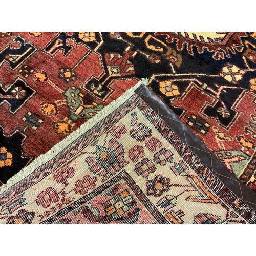 63 - A North-West Persian Tafresh rug / carpet, knotted in subdued tones of burgundy, indigo, and blue, o... 