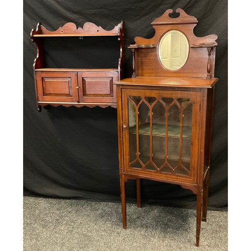 64 - An Edwardian inlaid mahogany music cabinet, shaped mirrored back above ebony and satinwood inlaid ov... 