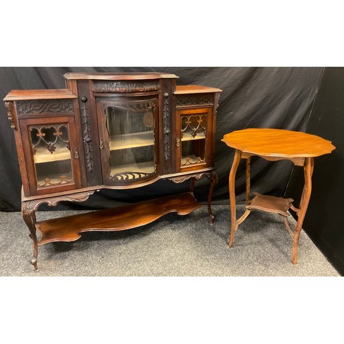 70 - A Victorian mahogany chiffonier base, bow-front centre, with central door having a curved glass pane... 