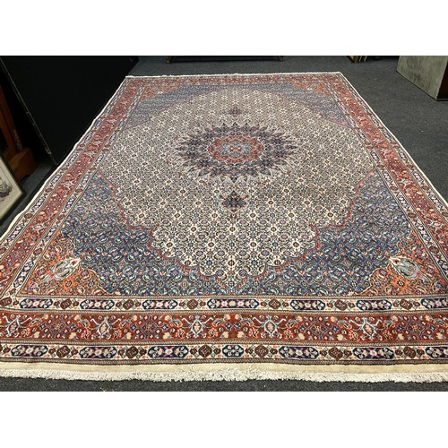 72 - A Persian Moud rug / carpet, hand-knotted with an intricate medallion within and field of stylised f... 