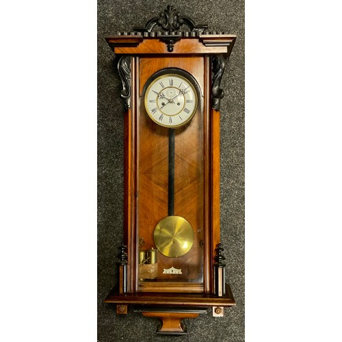 76 - A Victorian Walnut and ebonised walnut Vienna wall clock, carved cresting, and brackets, white ename... 