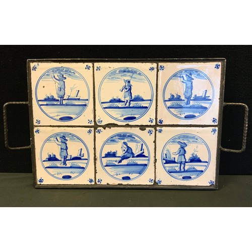 81 - A set of six 18th century style Dutch Delft tiles, mounted in a later metal tray, each tile measurin... 