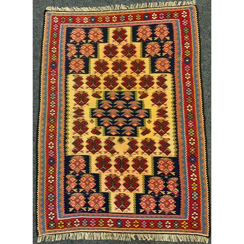 82 - A North-West Persian Senneh Kilim rug / carpet, knotted in earthy tones of red, ochre, cream, black,... 