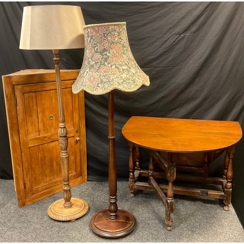 92 - A late 19th century pine corner cupboard, 116cm tall x 74cm wide x 35.5cm deep;  an oak gate leg tab... 